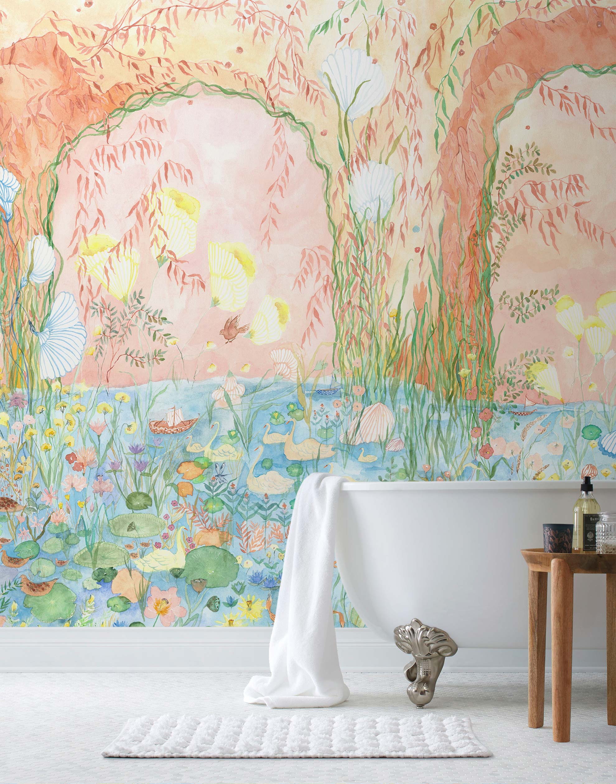 Watercolored swans, turtles, frogs, and fish swim in a flora filled pond beneath an arch of climbing plants and grasses. Lily Pond Mural contains a rainbow of soft watercolors - yellow, peach, apricot, green and blue. Hillery Sproat + Hygge & West