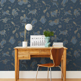 Our In the Stars wallpaper is inspired by Urania’s Mirror, a 19th-century set of astrology charts. This hand-drawn pattern evokes the mysterious motion of celestial bodies. This wallpaper features blue and gold motifs on a navy background and was designed by Julia Rothman.