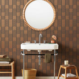 Wallpaper with undulating copper lines that form rhythmic columns on a dark gray background | Schoolhouse + Hygge & West