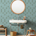 Wallpaper with undulating green lines that form rhythmic columns on a blue background | Schoolhouse + Hygge & West