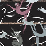 Balancing Act (Ebony) wallpaper features colorful dancing monkeys and rabbits on a black background