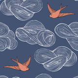 Daydream (Indigo) wallpaper features a pattern of flying birds and floating clouds in orange white and blue
