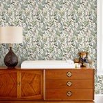 Secret Garden (White) wallpaper features shades of green, brown and pink plants, birds and butterflies on a true white background