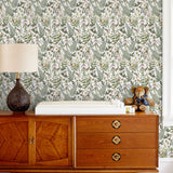Secret Garden (White) wallpaper features shades of green, brown and pink plants, birds and butterflies on a true white background