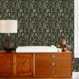 Secret Garden (Ebony) wallpaper features shades of green, pink and taupe plants, birds and butterflies on black background