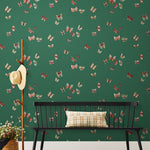 Butterflies (Malachite) featuring red, sage and yellow butterflies on a green background | Nathalie Lete + Hygge & West