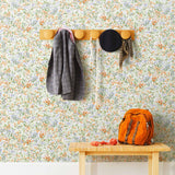 Summer (Bluebell) wallpaper features loose brushstrokes that capture the movement of wild flowers and grasses swaying in the breeze. Orange, blue, purple, and green watercolored flora on a white background | Hygge & West
