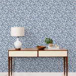 Olive Grove (Blue) featuring a leafy vine motif in shades of blue with light blue accents on a true white background | Schoolhouse x Hygge & West Wallpaper Collection